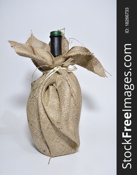 Wine bottle gift dresed in a sack cloth. Wine bottle gift dresed in a sack cloth