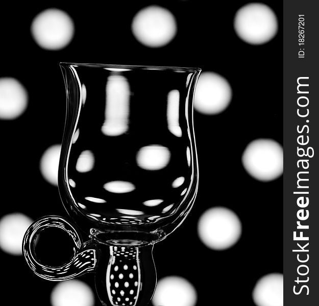 An abstract shot of a single coffee glass against a trendy background. An abstract shot of a single coffee glass against a trendy background