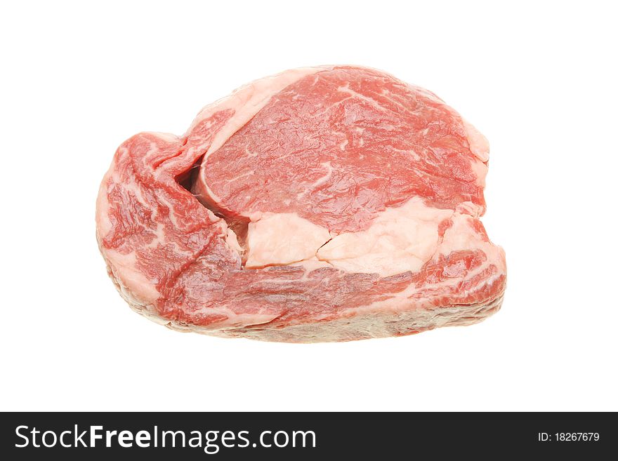Piece of raw rib eye steak isolated on white