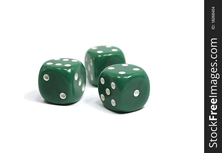 Three green dices on a white background