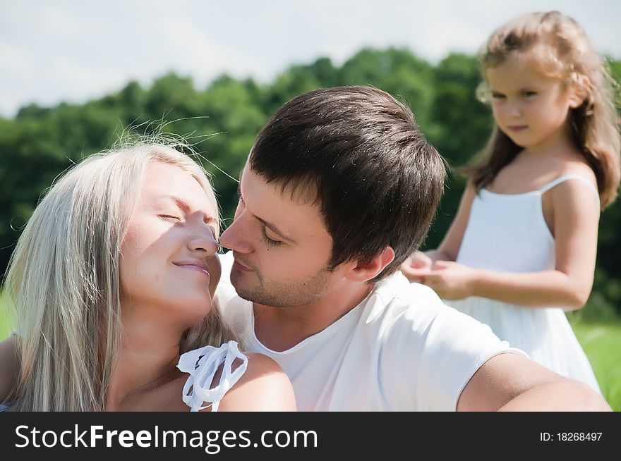 Happy Young family on the meadow. Happy Young family on the meadow