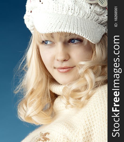 A wonderful girl is in a white cap. A wonderful girl is in a white cap