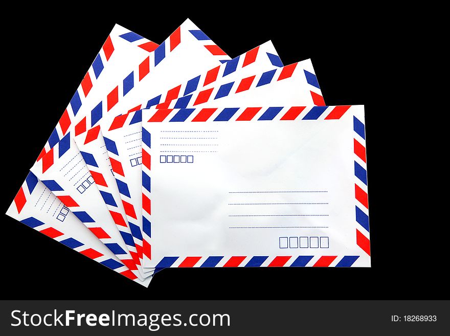 Air mail envelope isolated on black