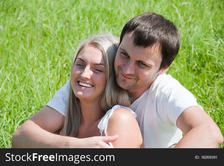Young couple on the meadow