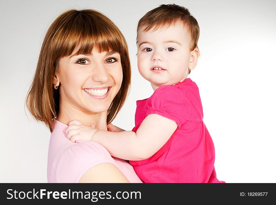 Happy mother with a baby on a white background