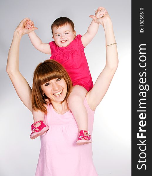 Happy mother with a baby on a white background