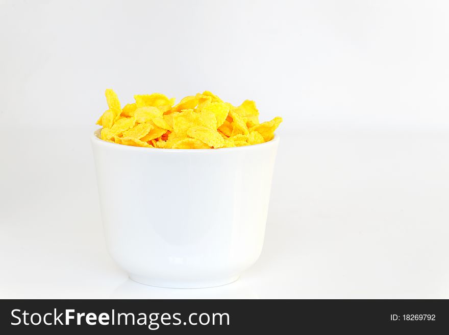 Bowl with corn flake isolated on white