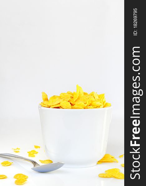 Bowl with corn flake isolated on white