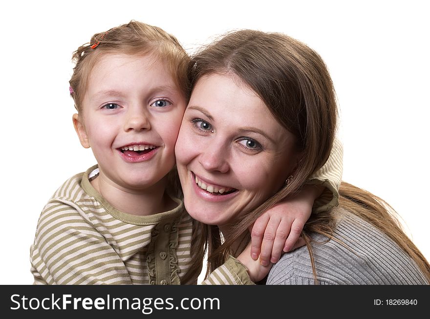 Mother and her little daughter hugging each other isolated over white background. Mother and her little daughter hugging each other isolated over white background