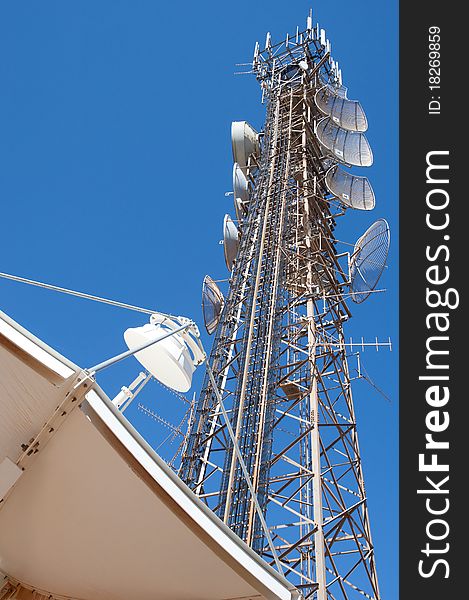 Microwave tower and satellite antenna using in telecommunication. Microwave tower and satellite antenna using in telecommunication