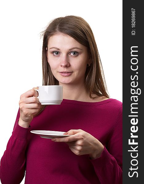 Young woman with white cup and saucer in the hands isolated over white background. Young woman with white cup and saucer in the hands isolated over white background