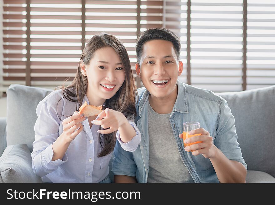 Asian Couple Lovers Enjoy Watching Entertainment Internet Streaming Via Smart Television