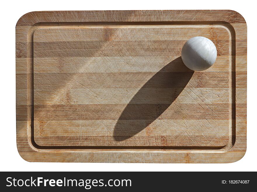 A Chicken Egg On A Cutting Board Is Isolated On A White Background. Minimalism. Dietology And Healthy Nutrition
