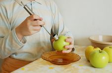 Taking Out An Apple Core. Focus On A Corer. Royalty Free Stock Images Taking Out An Apple Core. Focus On A Corer. Royalty Free Stock Images