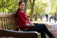 Woman Sitting In A Park On A Wooden Bench, Stock Photography Woman Sitting In A Park On A Wooden Bench, Stock Photography