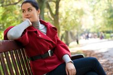 Woman Sitting In A Park On A Wooden Bench, Royalty Free Stock Image Woman Sitting In A Park On A Wooden Bench, Royalty Free Stock Image