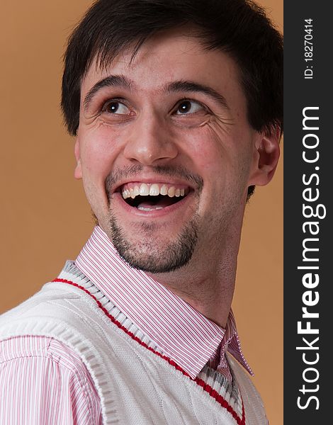 Young man with beard smiling