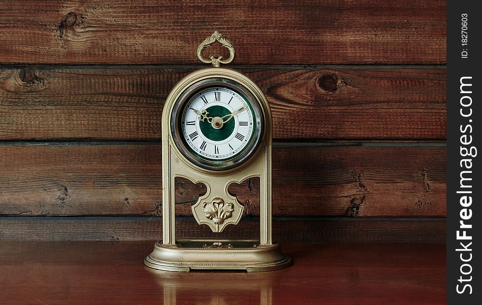 Old Antique Clock on wooden table. Old Antique Clock on wooden table