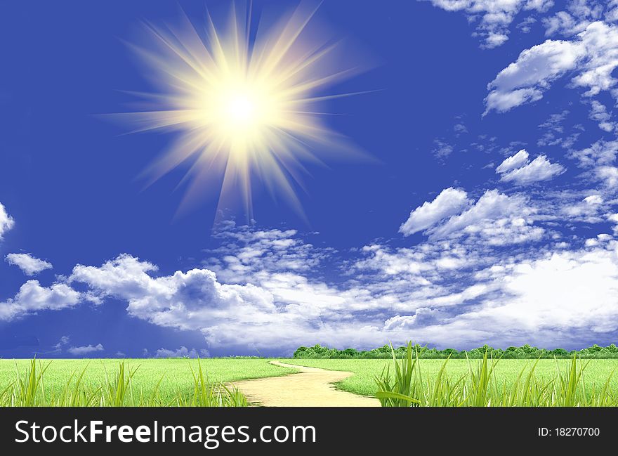The sun in clouds in the blue sky and a green glade
