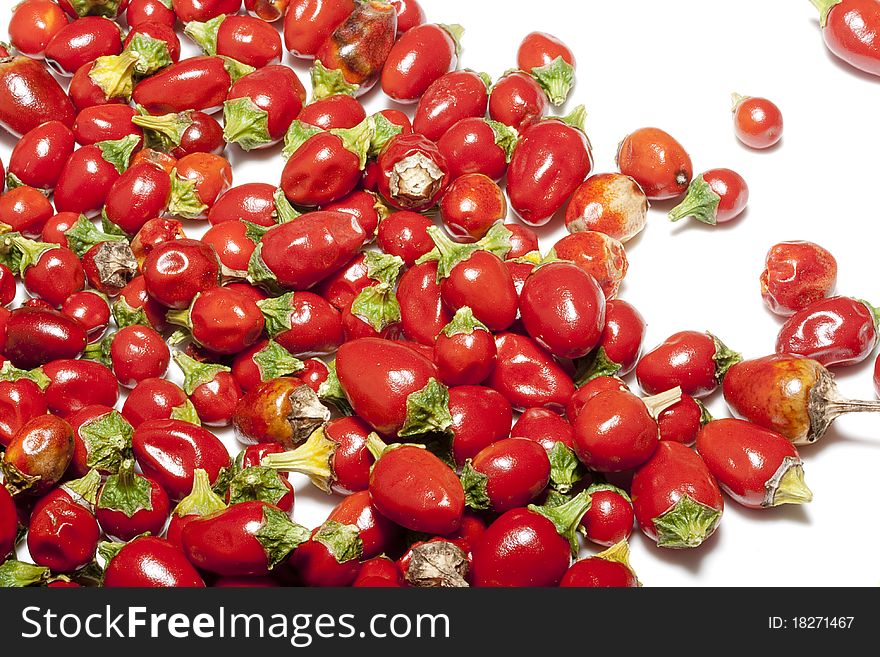 Pods are a little hot pepper on a white background.