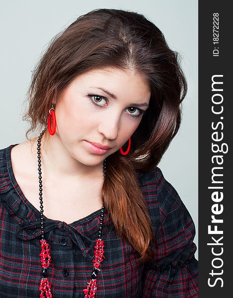 Portrait of beautiful young girl on the grey background. Portrait of beautiful young girl on the grey background