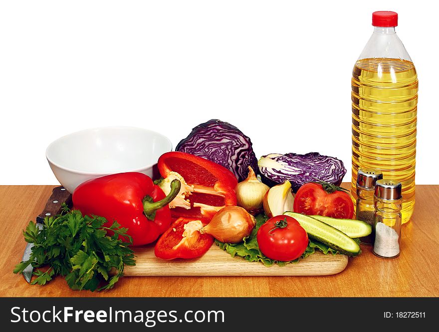 Sunflower seed oil and vegetables for preparation of salad. Sunflower seed oil and vegetables for preparation of salad