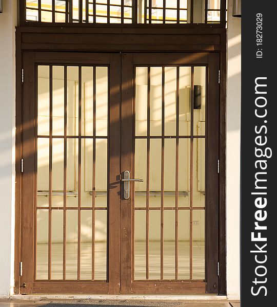 Closeup of Wood & glass arch door. Closeup of Wood & glass arch door.