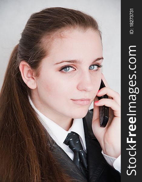 Happy business woman talking by phone