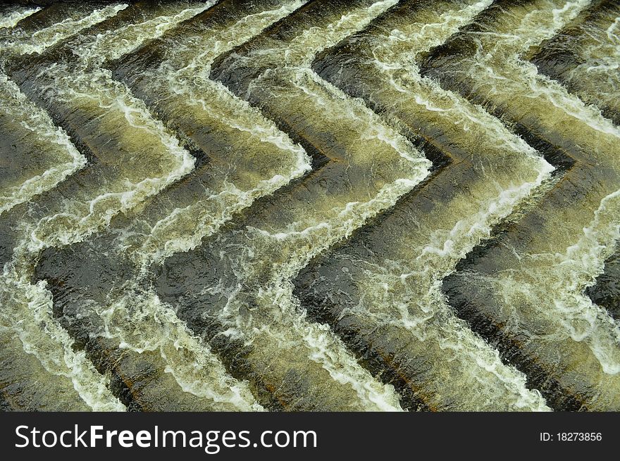 Lines of water on weir