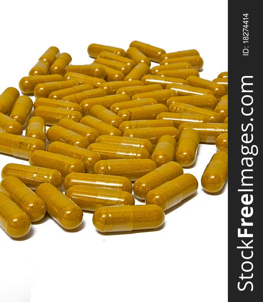 Yellow tablet isolated