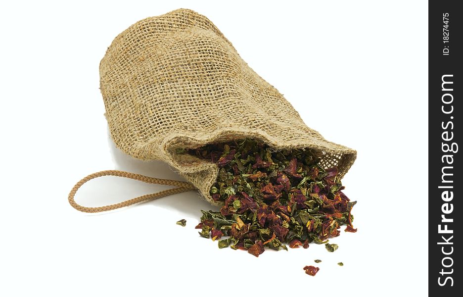 Dried paprika in a bag on a white background