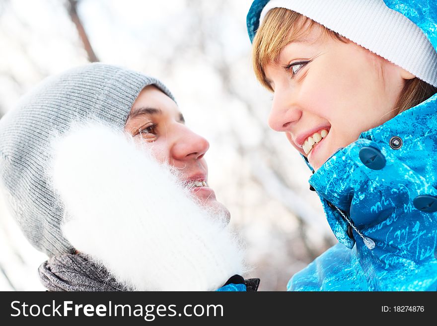 Young playful couple has a fun. Winter