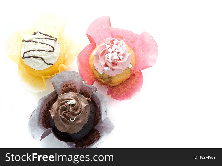 Three colorful muffin on a white background