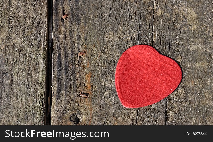 Heart-shaped confetti landed on wood