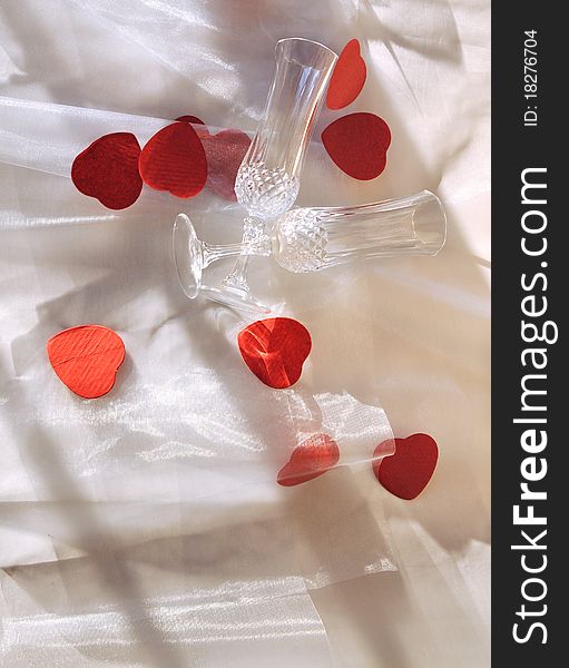Champagne glasses and put on sheer heart shaped confetti. Champagne glasses and put on sheer heart shaped confetti