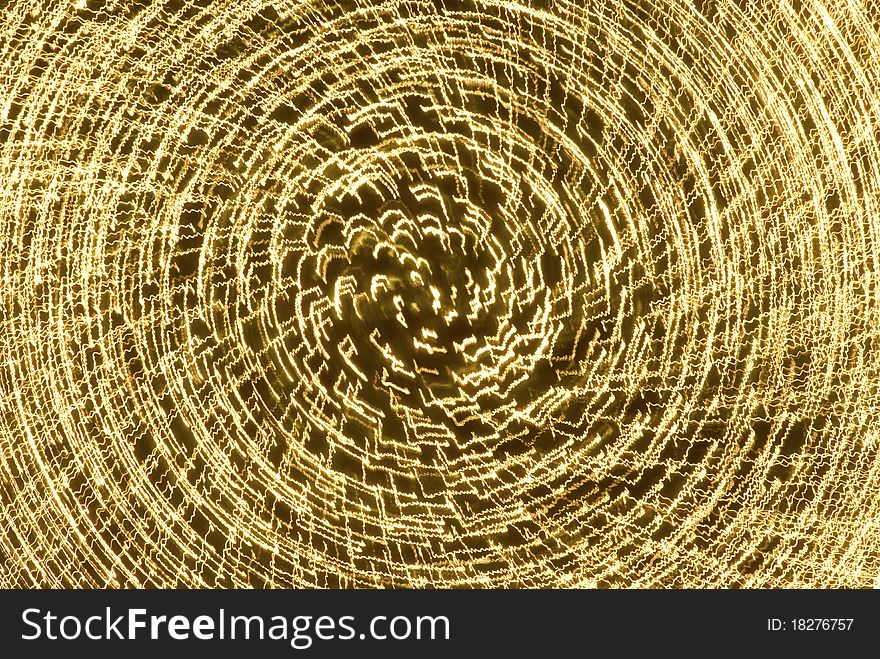 Golden Vortex Starburst abstraction of light created by zooming the camera lens during exposure. Golden Vortex Starburst abstraction of light created by zooming the camera lens during exposure.