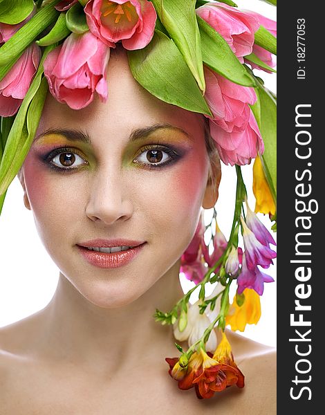 Beauty woman portrait with wreath from flowers on head over white background