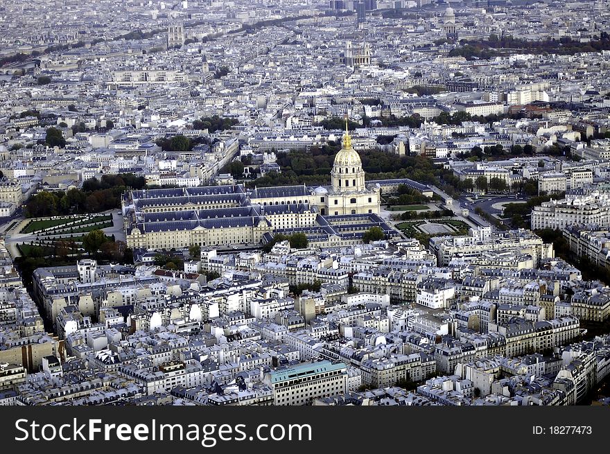 A bird's-eye view of Les Invalides of Paris, with its golden dome shining.