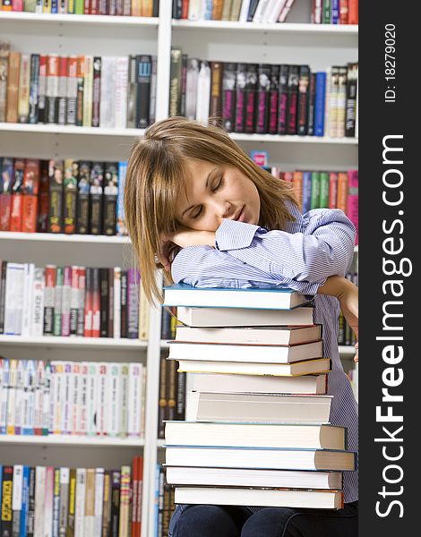 Young Woman Sleeping With Books