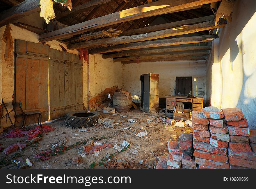 Interior of an old ruined house, old textures and furniture. Interior of an old ruined house, old textures and furniture.