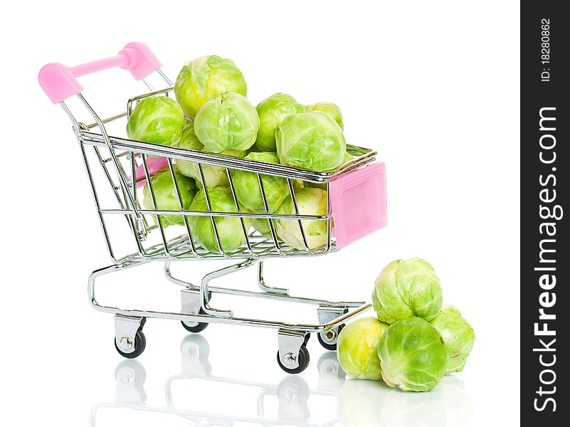 Brussels sprouts in the shopping cart on white