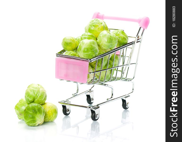 Brussels sprouts in the shopping cart on white