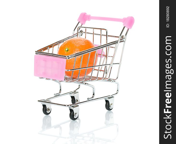 Orange in the shopping cart. Isolated..