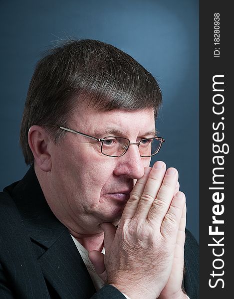 Portrait of the elderly man in a dark jacket. Portrait of the elderly man in a dark jacket.