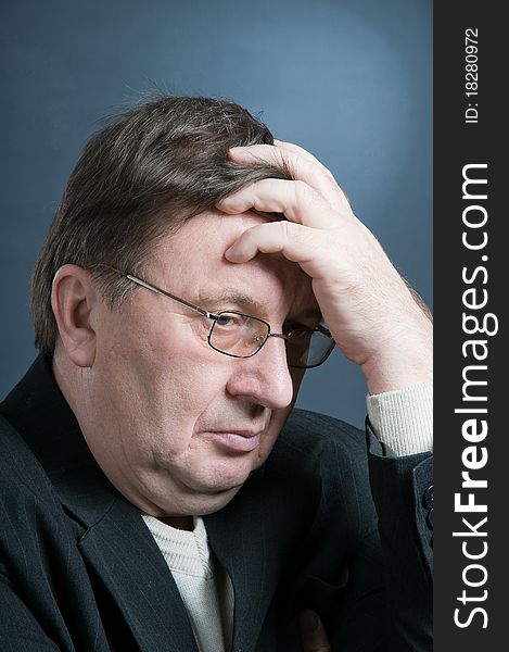 Portrait of the elderly man in a dark jacket. Portrait of the elderly man in a dark jacket.