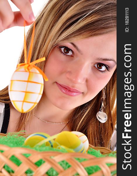 Young beautiful girl with easter egg in her hand