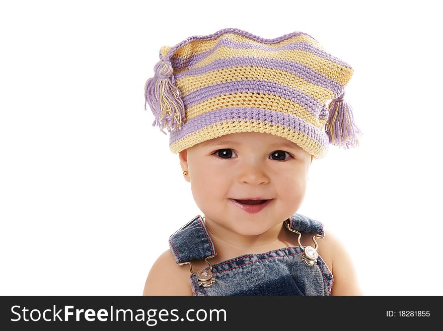 Portrait of cute happy smiling baby girl in funny hat isolated on white background