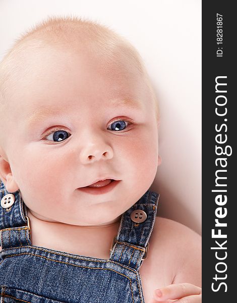 Portrait of cute smiling baby-boy with blue eyes, studio shot. Portrait of cute smiling baby-boy with blue eyes, studio shot