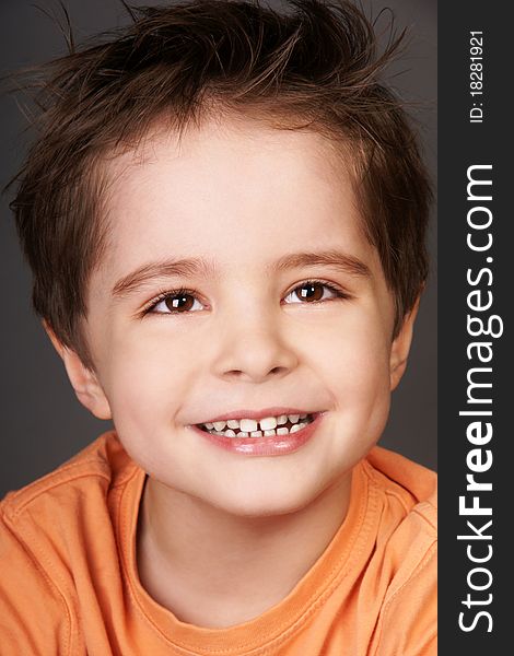 Close-up portrait of joyful smiling beautiful little boy, studio shot. Close-up portrait of joyful smiling beautiful little boy, studio shot