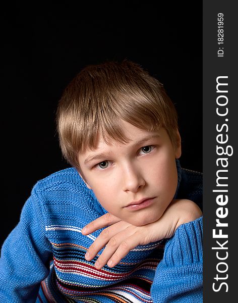 Portrait Of A Teenager On A Black Background